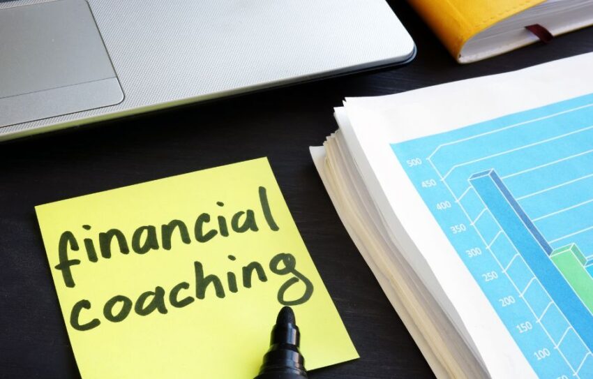 A yellow post-it note which says 'Financial Coaching'