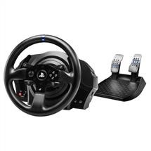 A black gaming steering wheel and two car control pedals