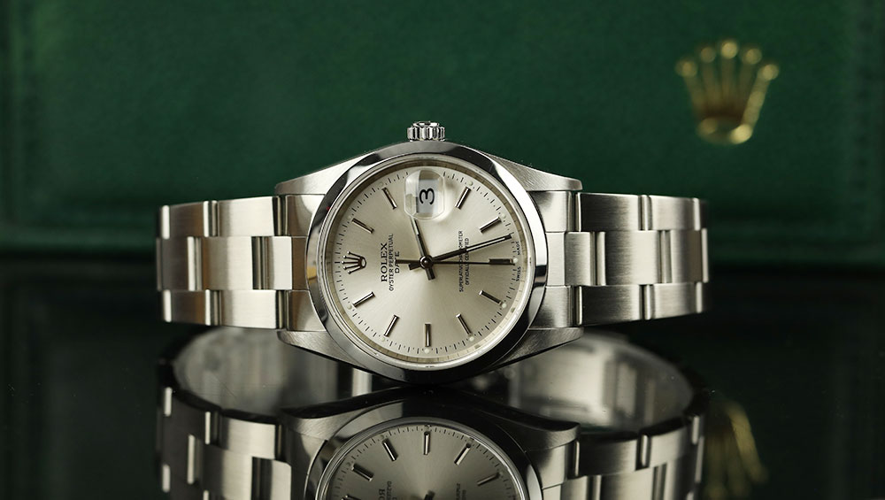 A gold watch placed on it's side. The hands are black and the face is gold.